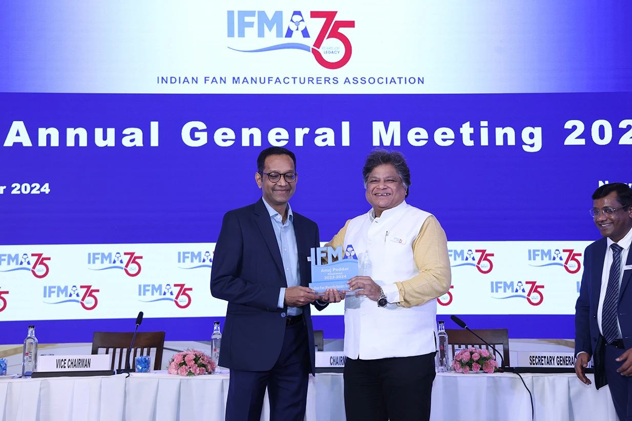 Incoming Chairman presenting a memento to outgoing Chairman Anuj Poddar